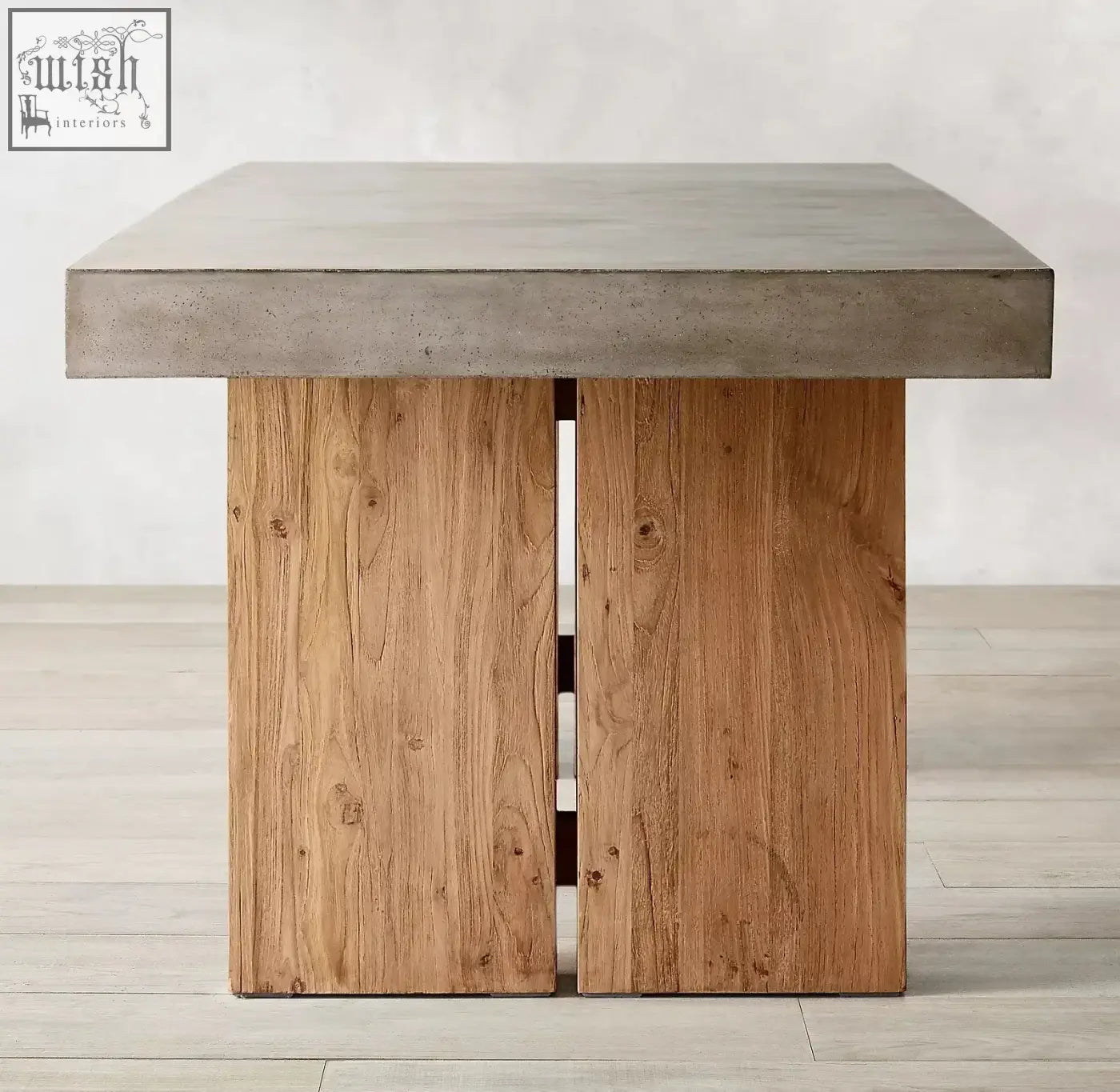 Modern rectangular nakamura dining table with gray concrete top and rustic wooden legs showing visible grain