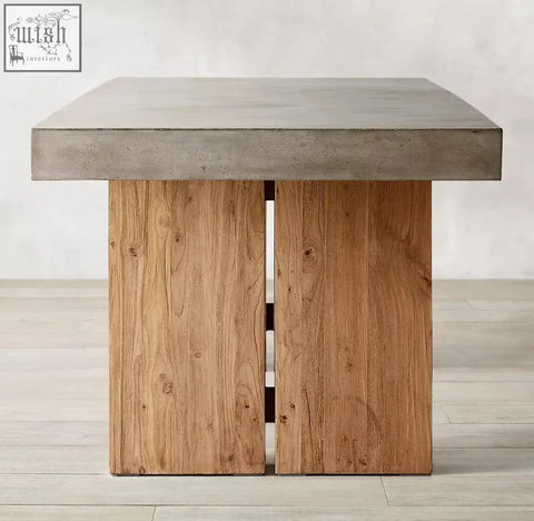 Modern rectangular nakamura dining table with gray concrete top and rustic wooden legs showing visible grain