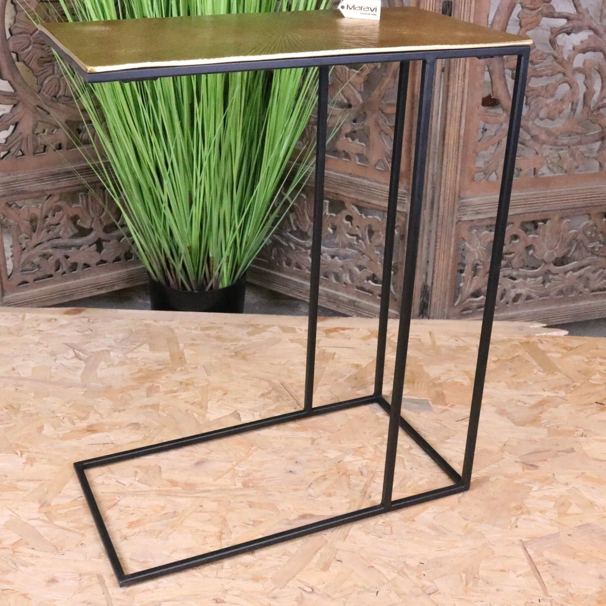 Modern black metal frame side table with a gold-finished top perfect as a stylish gold sofa table or gold sofa accent