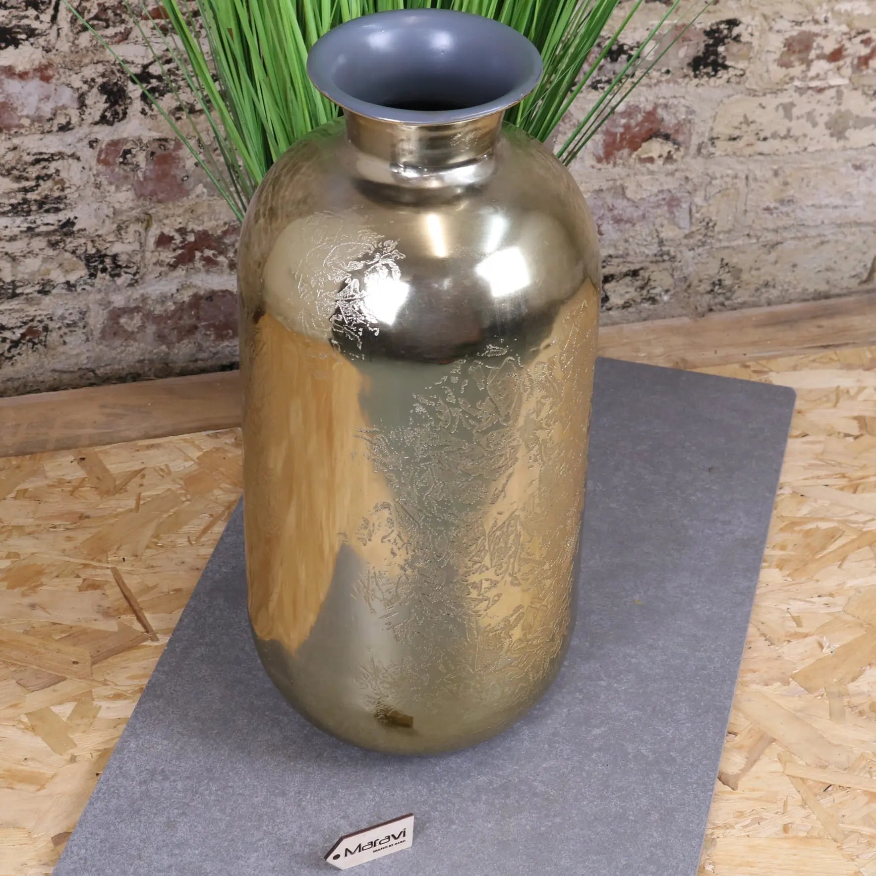 A sleek metallic gold large vase with brushed finish and subtle embossed floral patterns nandgaon elegance design