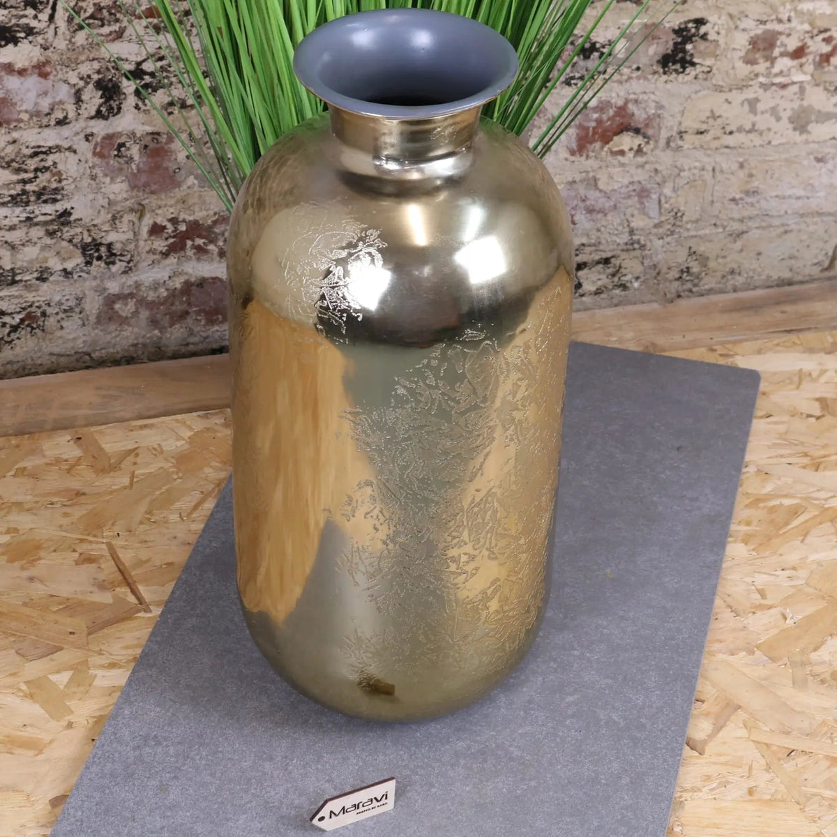 A sleek metallic gold large vase with brushed finish and subtle embossed floral patterns nandgaon elegance design