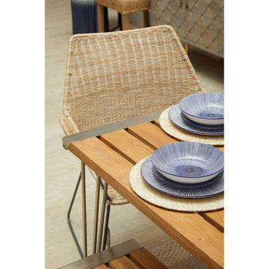 Woven beige rattan chair with metal legs paired with nandri slatted teak wood dining table for wood dining table setup