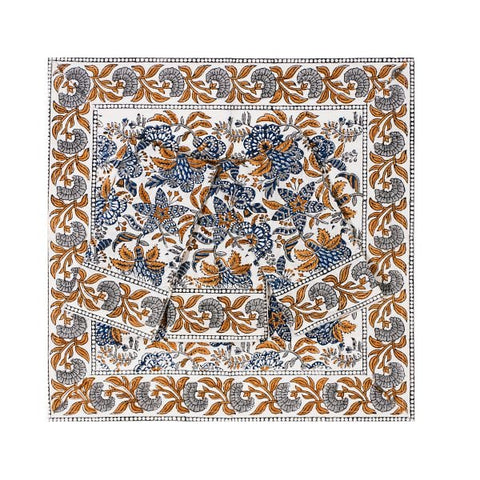 A set of 4 coromandel nut blue silk napkins with intricate navy blue burnt orange and gray floral paisley patterns on white