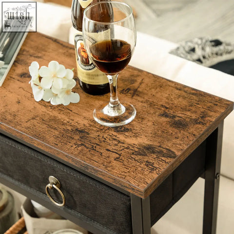 Narrow entryway console table with rustic wooden top dark metal frame and black fabric drawer front for antique appearance