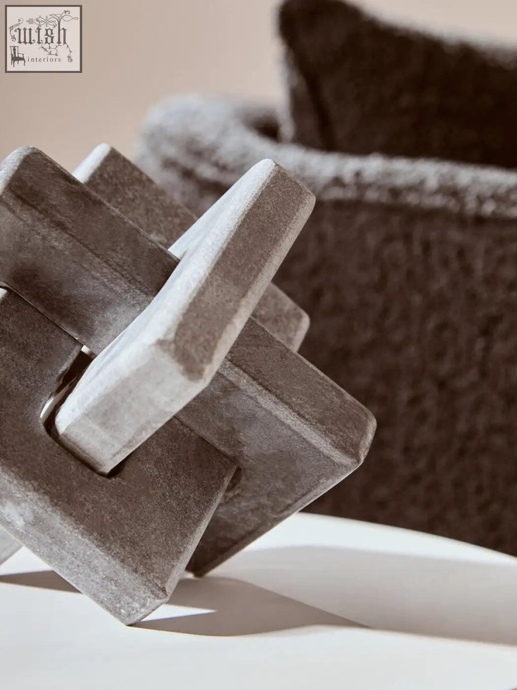 Nason grey marble knot sculpture with a textured matte finish and geometric interlocking grey marble knot design