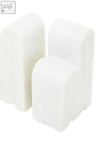 White plastic chair-shaped protective corner guards included with nason set of 2 white marble bookends