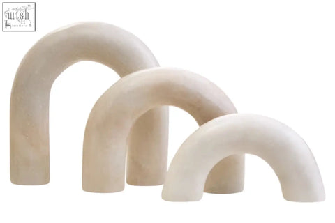 Set of three cream white marble arch decor sculptures with subtle veining and smooth matte finish