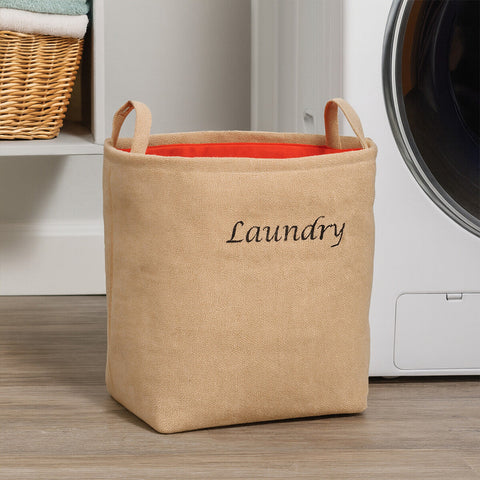Beige jute hessian laundry bag with orange interior and embroidered laundry text perfect for laundry storage