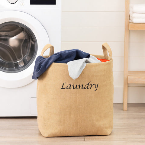 Beige jute hessian laundry bag with black embroidered laundry text and sturdy handles for easy use