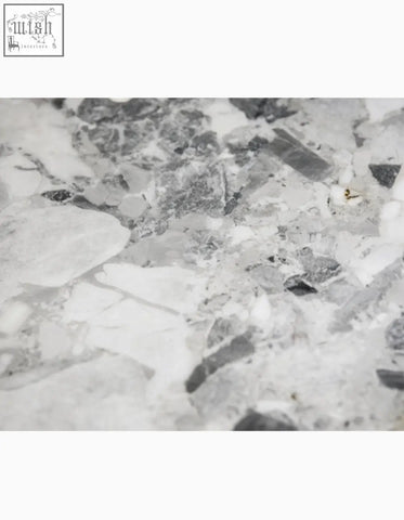 Natural marble dining table with gray and white marbled stone surface adds elegance to any dining table setup