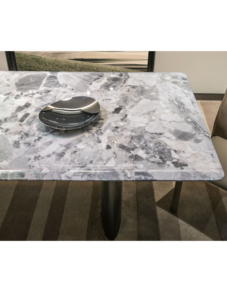 Gray and white marble dining table with sleek modern legs perfect for natural marble dining spaces and marble dining table setups