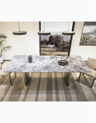 Long rectangular dining table with gray white natural marble top and sleek metallic legs marble dining table