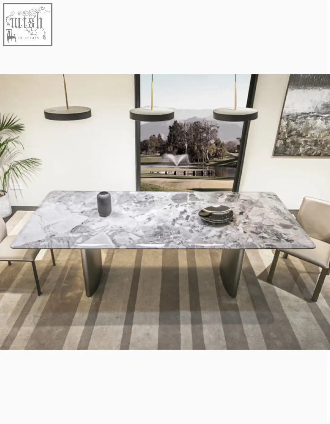 Long rectangular dining table with gray and white natural marble top and sleek metallic legs for elegant dining space