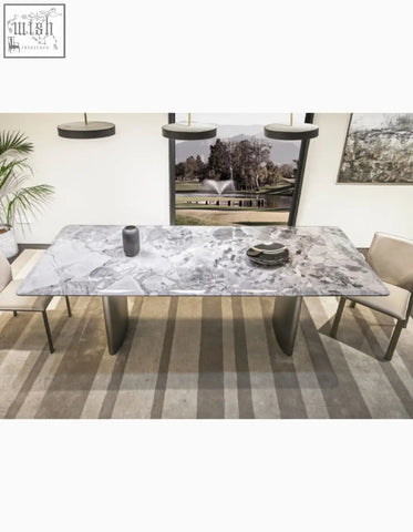 Long rectangular natural marble dining table with gray white marble top and sleek dark metal legs adds style