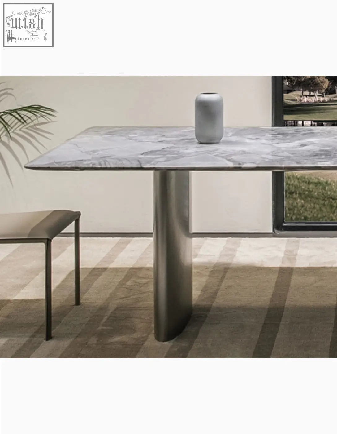 Modern gray marble dining table with sleek cylindrical metal legs adds natural marble dining style to any space
