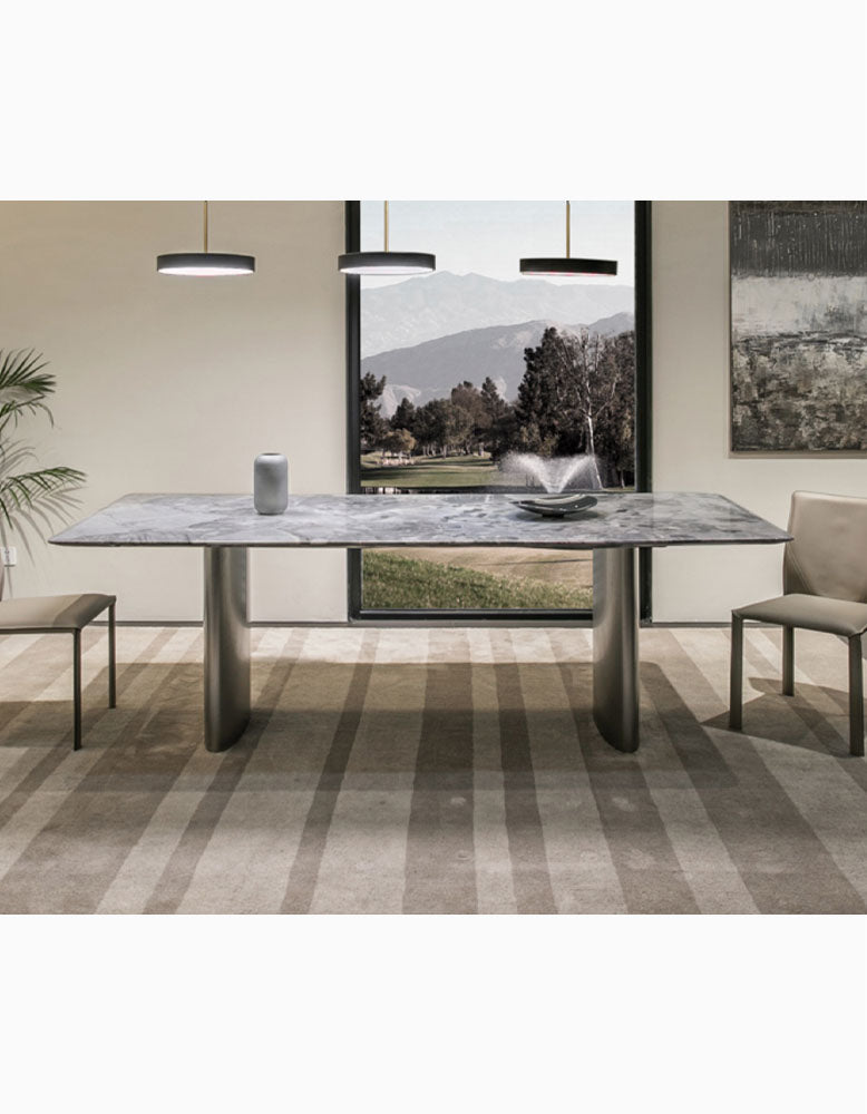 Modern rectangular dining table with gray natural marble top and sleek metallic legs perfect as a marble dining table