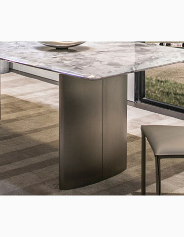 Modern dining table with sleek gray natural marble top and brushed metal legs for stylish marble dining table setups