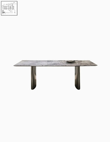 Modern dining table with a sleek gray natural marble top and polished chrome legs that dining table adds style