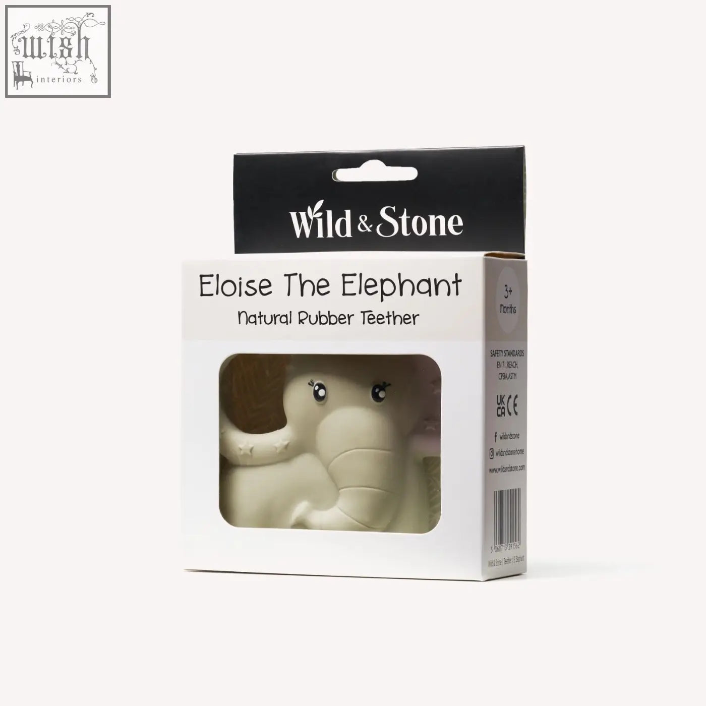 Natural rubber teether shaped like an off-white elephant with black bead eyes and a textured trunk hand crafted with food grade dyes