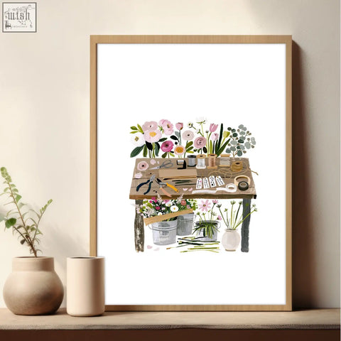 A rustic wooden table with floral arranging tools in a framed nature canvas wall art for flower shop decor set of 3