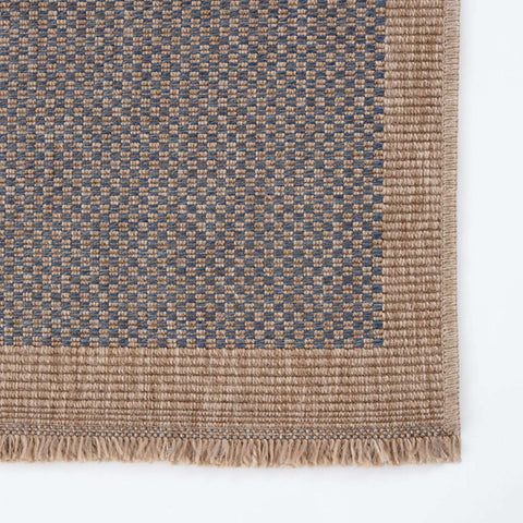 Beige and gray woven nature outdoor rug with textured checkered pattern and fringed edges for outdoor use