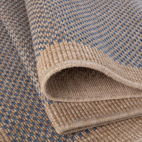 Beige and blue woven nature outdoor rug with textured herringbone pattern perfect for outdoor use