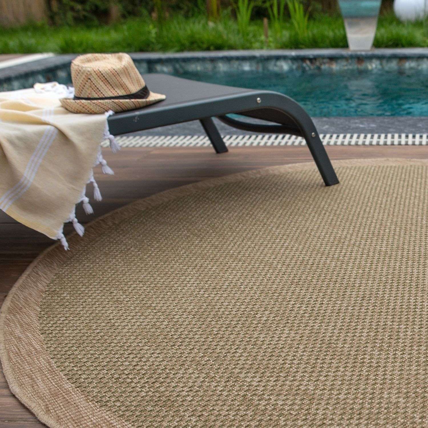 Beige woven nature outdoor rug green with textured braided pattern and rounded edges for outdoor use