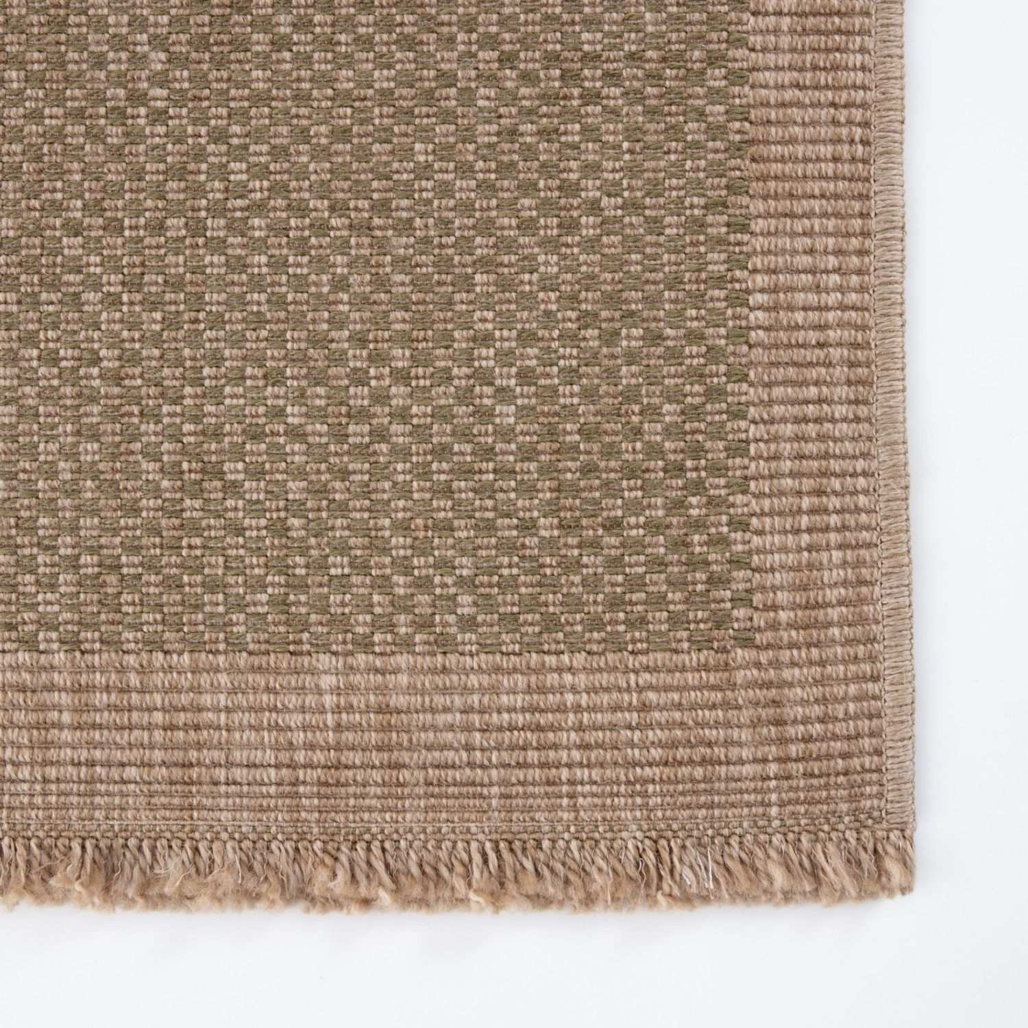 Beige woven nature outdoor rug green with textured interlaced pattern and fringed edges perfect for outdoor use