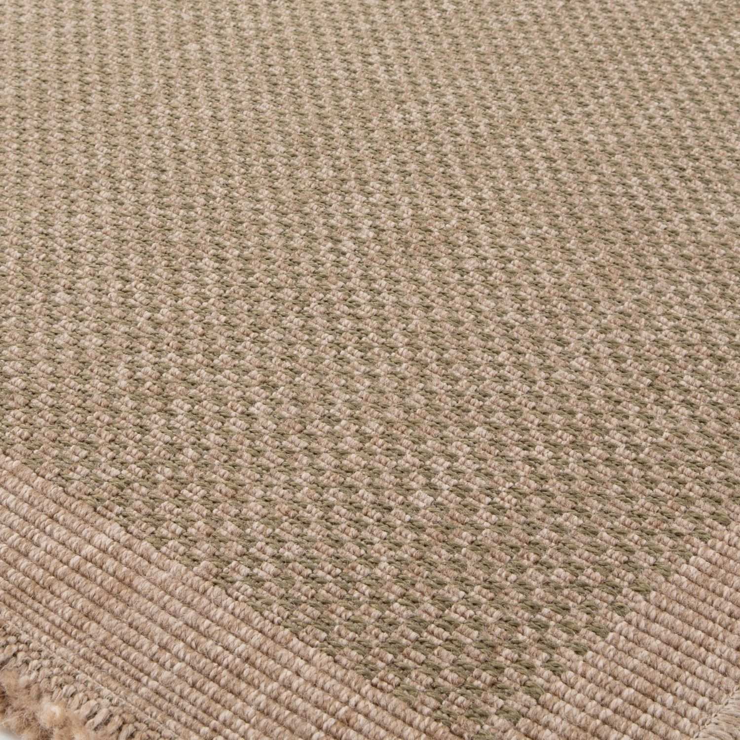 Beige woven nature outdoor rug green with textured natural fiber weave and frayed edges perfect for outdoor use