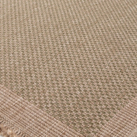 Beige woven nature outdoor rug green with textured natural fiber weave and frayed edges perfect for outdoor use