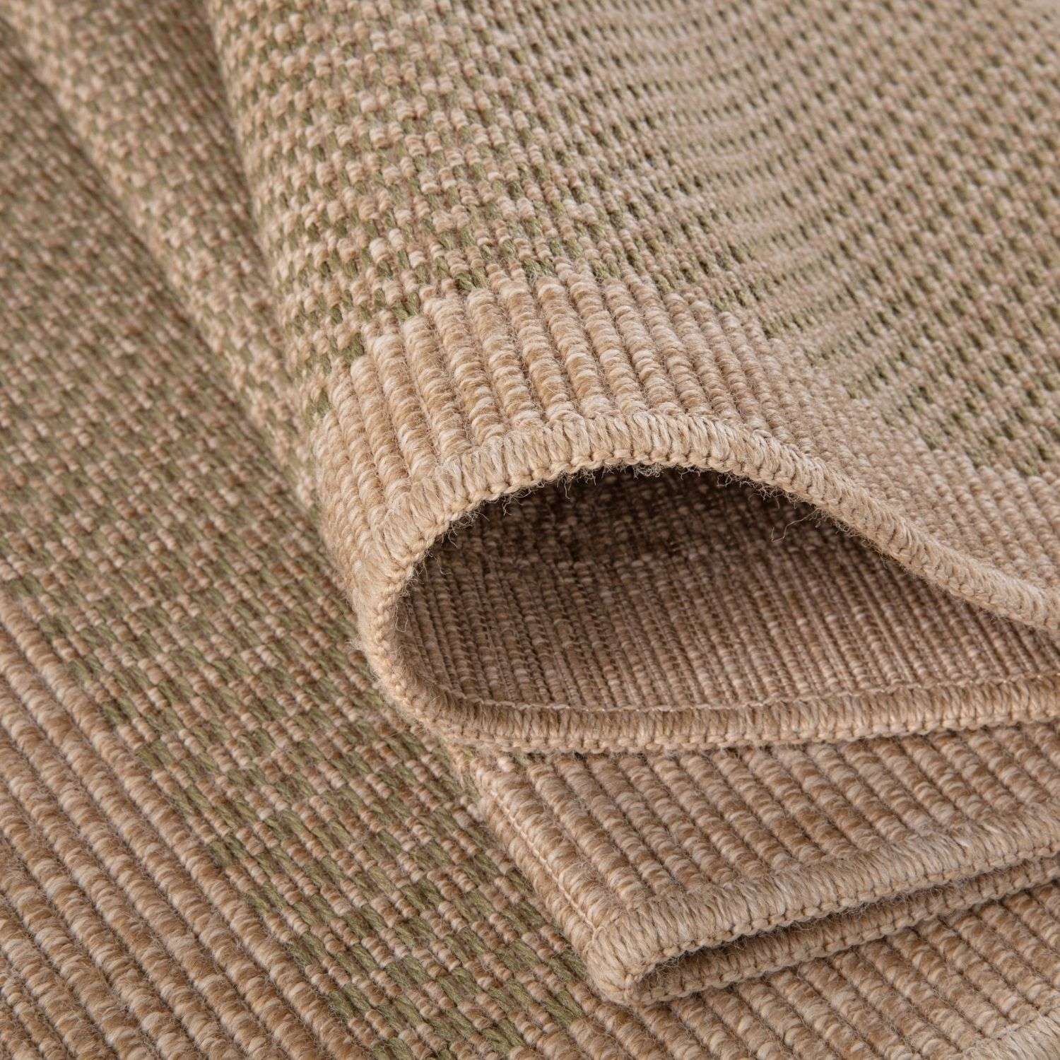 Beige woven nature outdoor rug green with textured ribbed pattern and neatly finished edges for outdoor use