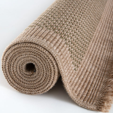 Beige woven nature outdoor rug green with ribbed textured pattern and frayed edges perfect for outdoor use