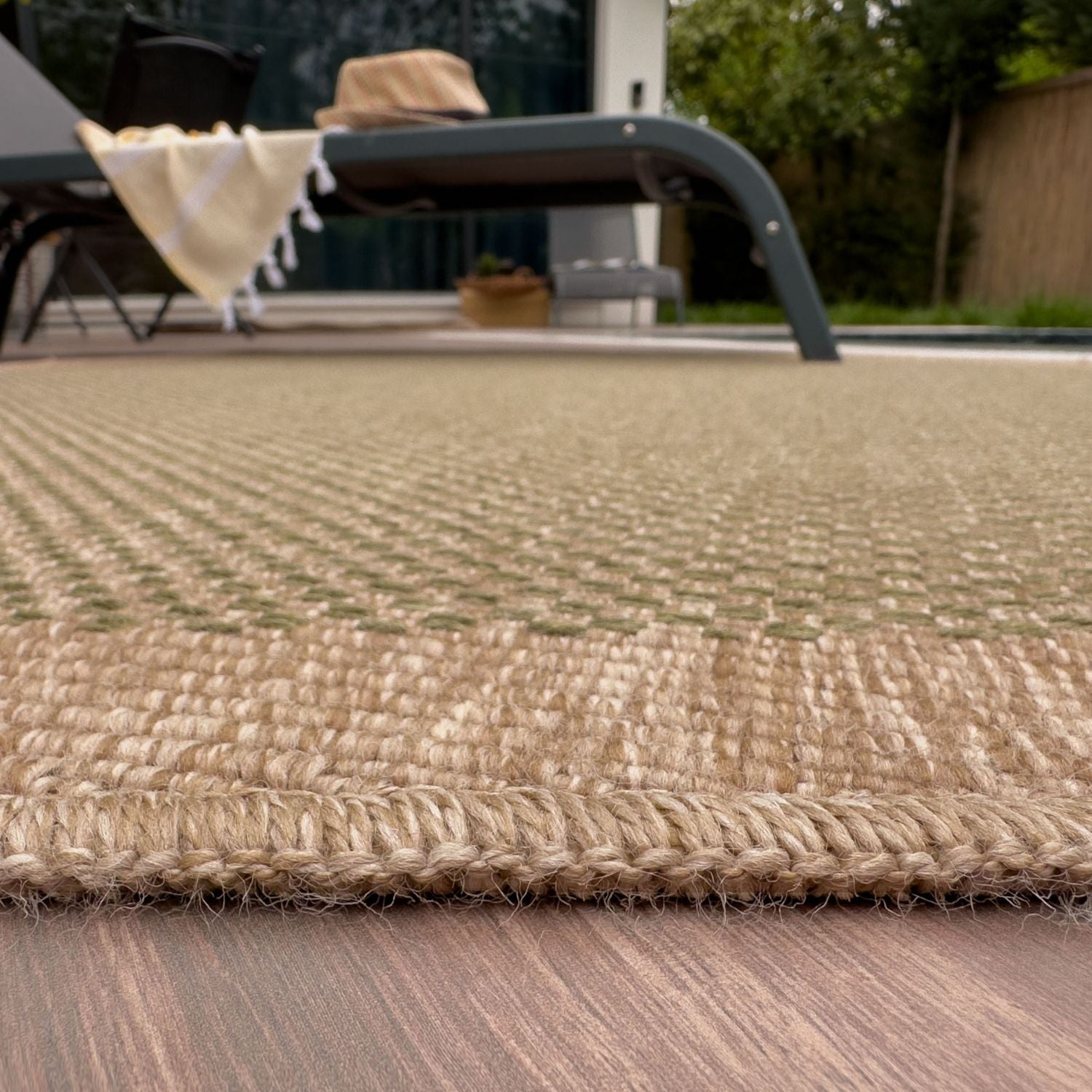 Natural fiber nature outdoor rug in beige and light brown with a textured woven pattern perfect for outdoor use