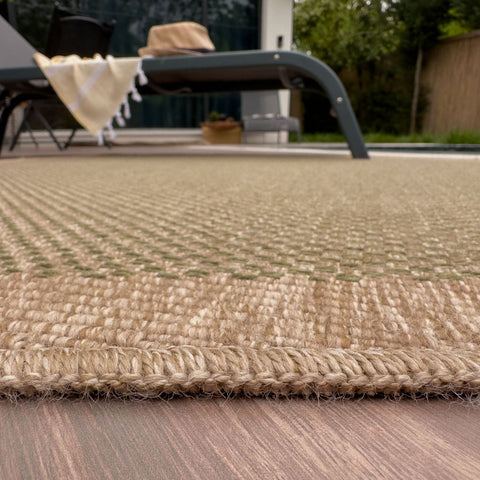 Natural fiber nature outdoor rug in beige and light brown with a textured woven pattern perfect for outdoor use