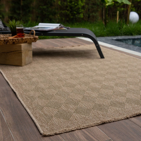 Beige woven nature outdoor rug with diamond pattern and frayed edges perfect for outdoor rug green spaces