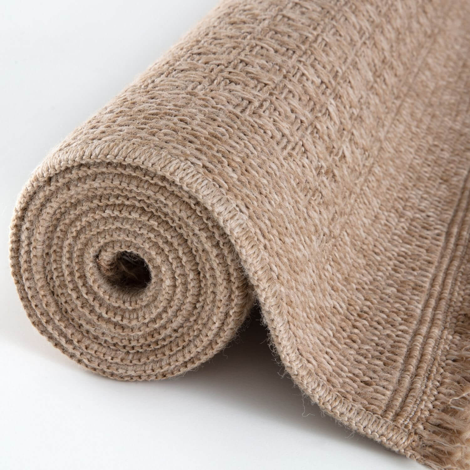 Beige textured jute nature outdoor rug neutral with woven pattern and fringed edges perfect for outdoor use