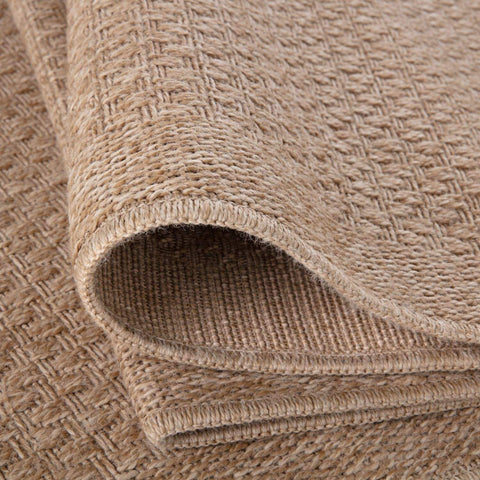Beige woven nature outdoor rug with textured herringbone pattern made from natural fibers outdoor rug neutral