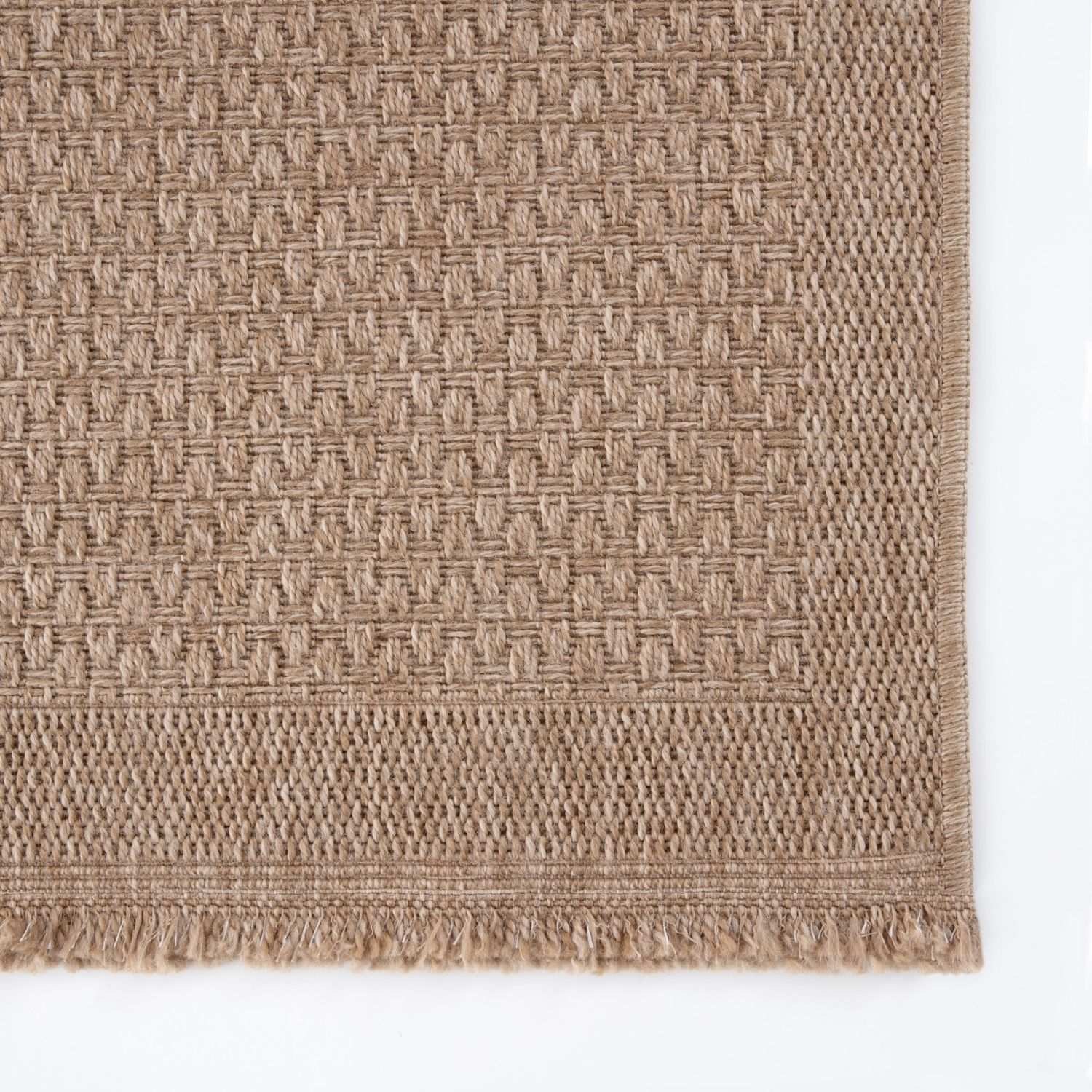Beige woven nature outdoor rug with textured basketweave pattern and fringed edges perfect outdoor rug neutral