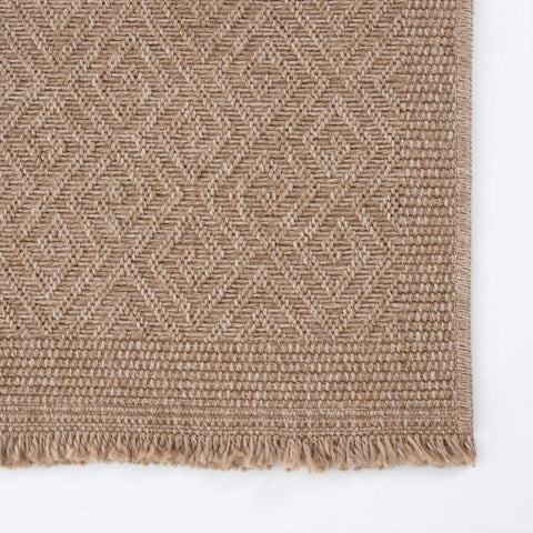 Beige woven nature outdoor rug with diamond pattern and fringed edges perfect as an outdoor rug neutral option