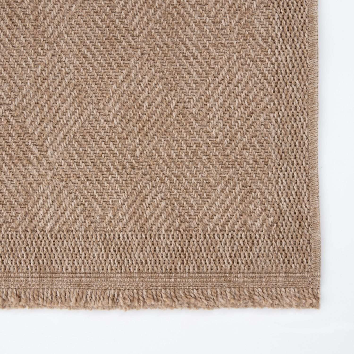 Beige woven nature outdoor rug with herringbone pattern and fringed edges perfect outdoor rug neutral choice