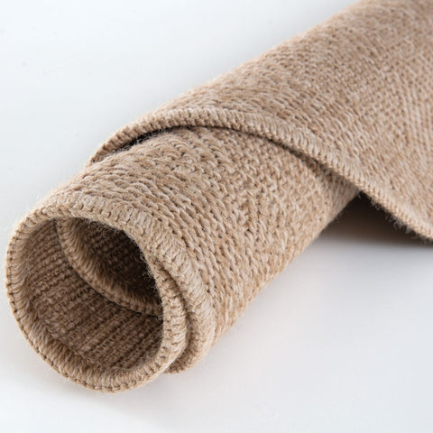 A rolled beige burlap nature outdoor rug with coarse woven texture in outdoor rug neutral style 5300n