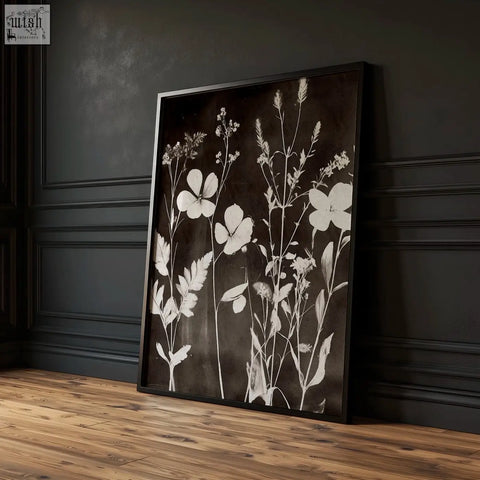Black-framed nature painting art prints with delicate white wildflower silhouettes on dark brown-black textured background