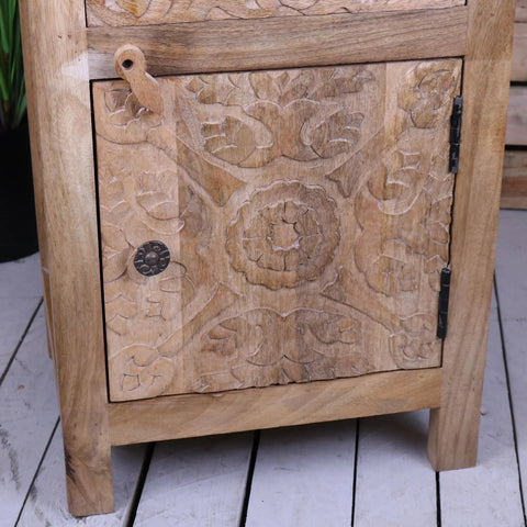 Nausel mango wood bedside cabinet hand carved with light brown finish intricate floral patterns and dark metal knob