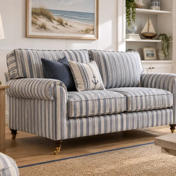 Nautical-striped two-seater sofa with rolled arms and dark wood legs.