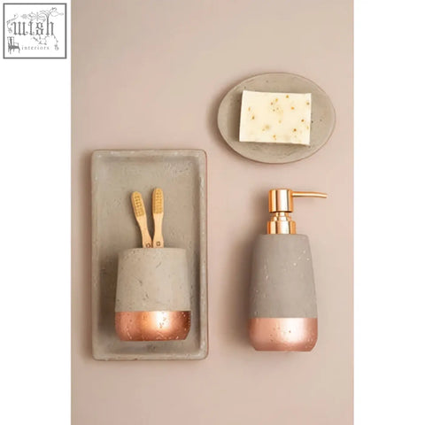 Gray concrete effect toothbrush holder with rose gold accents and matching neptune concrete effect soap dish