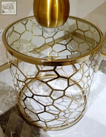 Gold-toned hexagonal nested glass side table with clear glass top and sintered stone lattice base