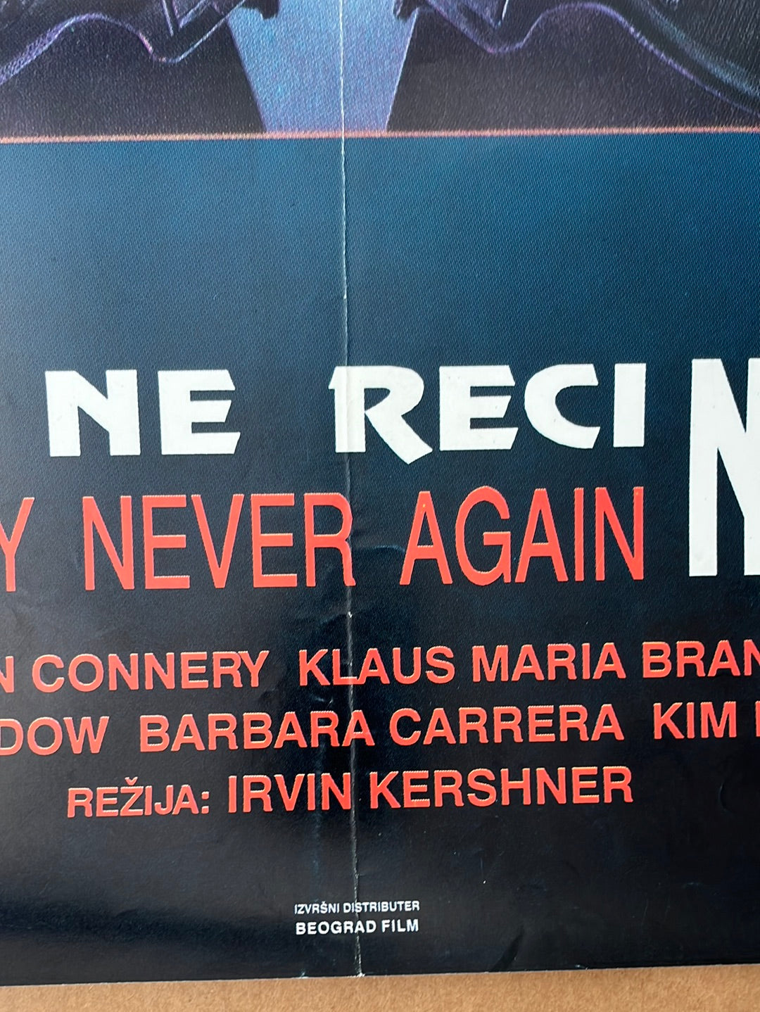 Original yugoslavian black movie poster for never say never again 1983 with bold white and red text and cast names