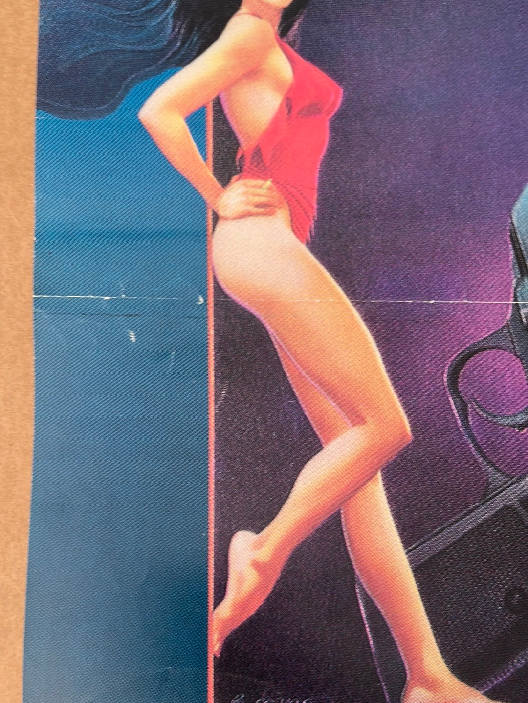 A vibrant red one-piece swimsuit with a plunging neckline on a stylized woman from the original yugoslavian never say never again poster