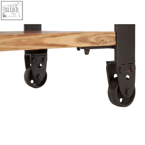 Black metal caster wheels attached to wooden plank of new foundry 3 drawer console table for easy mobility