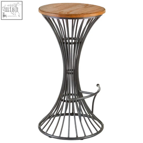 A sleek dark metal bar stool with a round elm wood top and curved footrest for stylish metal bar seating